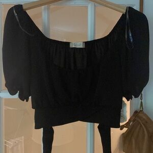 Medium black cropped black top. Super cute! New with Tags on.